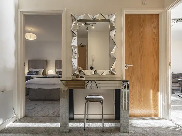 Hallway with vanity, showcasing professional quality real estate HDR editing.