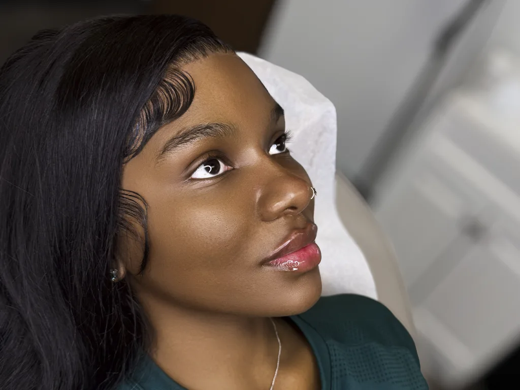 Portrait photo of a woman with professional skin retouching and natural glow enhancement by Clarity Edit